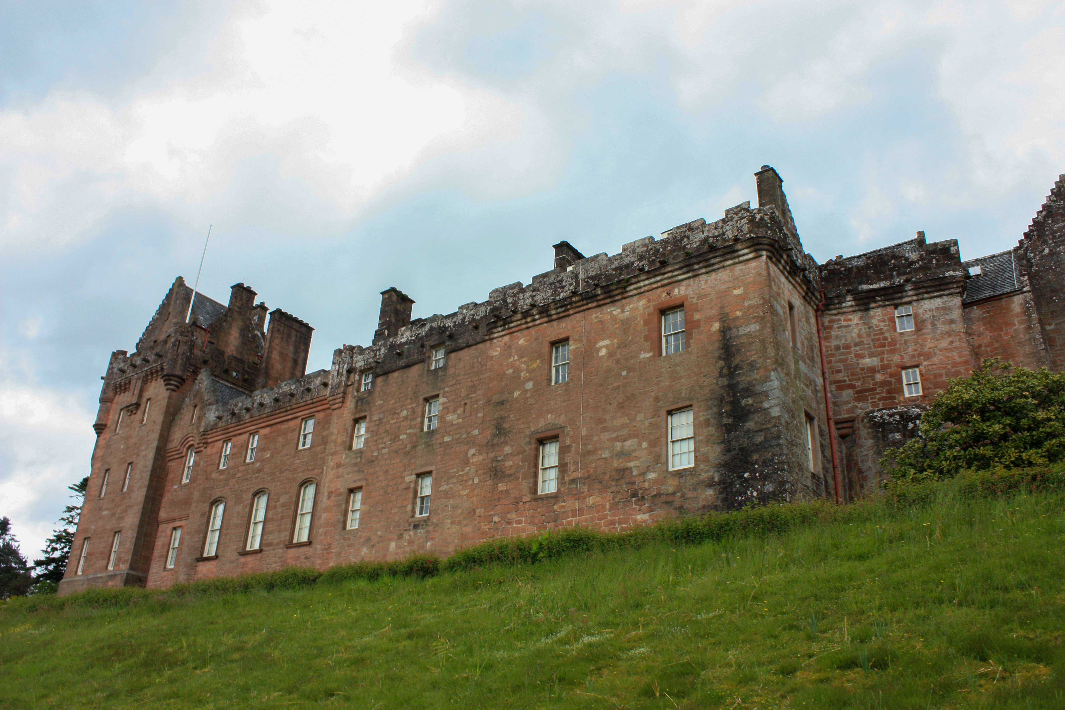 Back of Castle showing grass dropping away because of steep hill