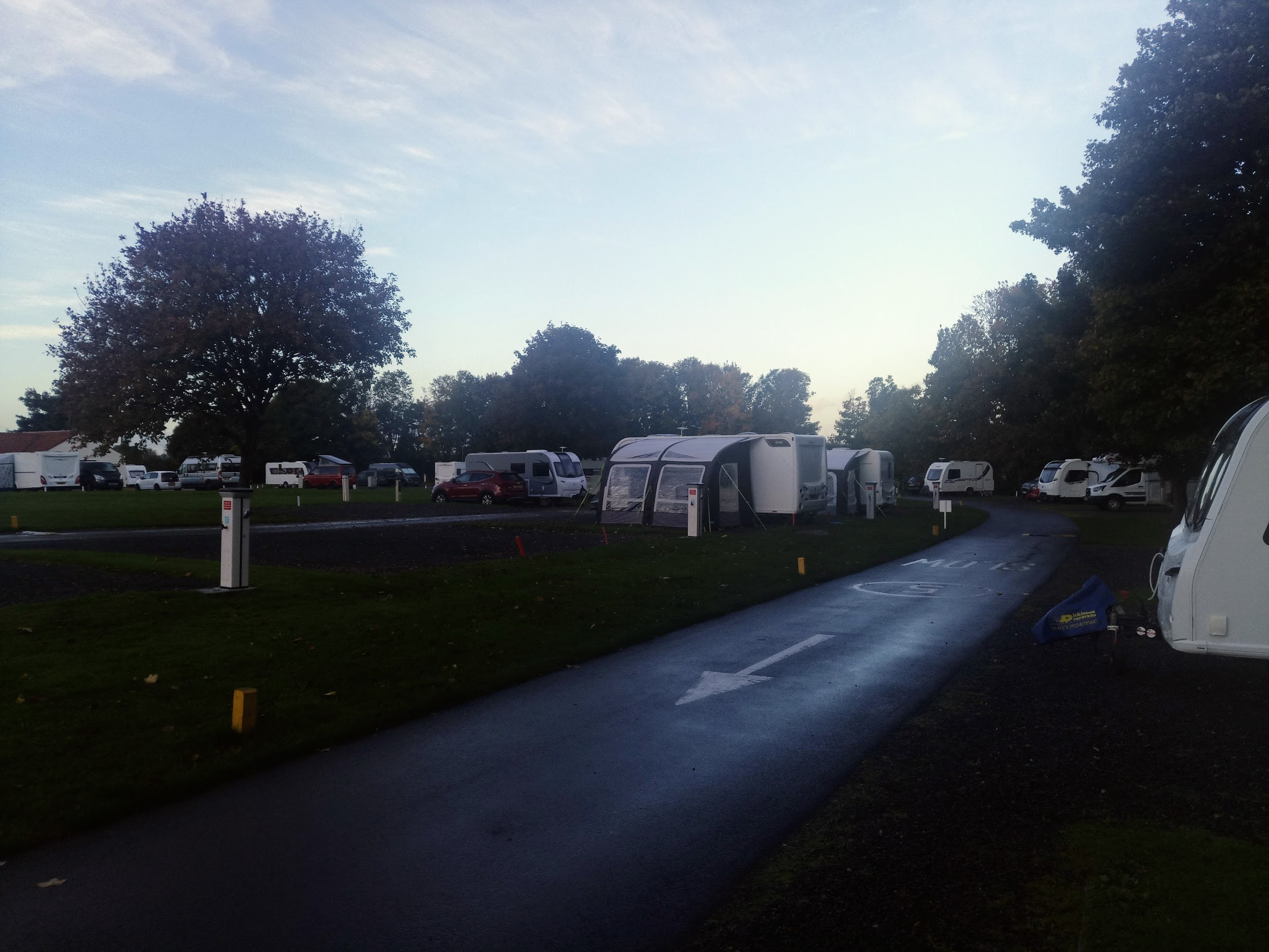 Photo of site showing plenty of motorhomes and caravans around.